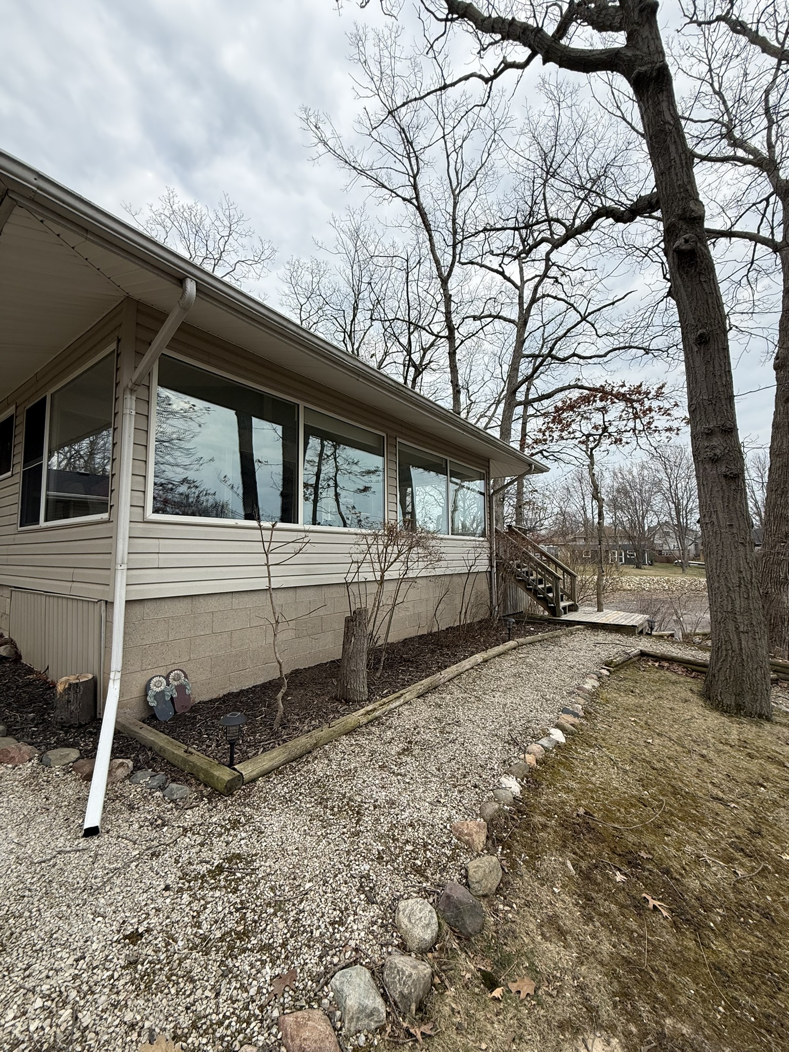 Cottage side exterior with stone path