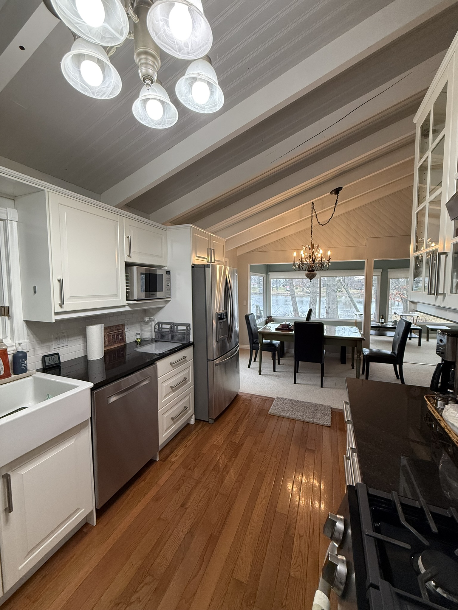 Open-plan kitchen to dining room with vaulted beamed ceiling